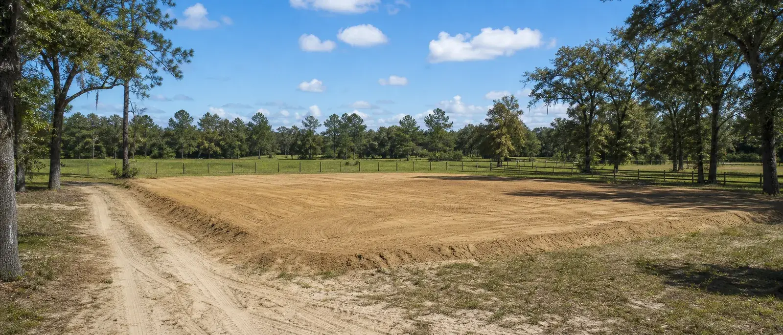 Level sandy homesite or shop pad on semi-rural acreage near High Springs, Florida.